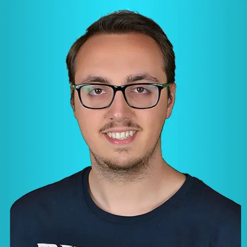 Profile photo of the site owner. Headshot of a smiling man wearing glasses against a blue background.